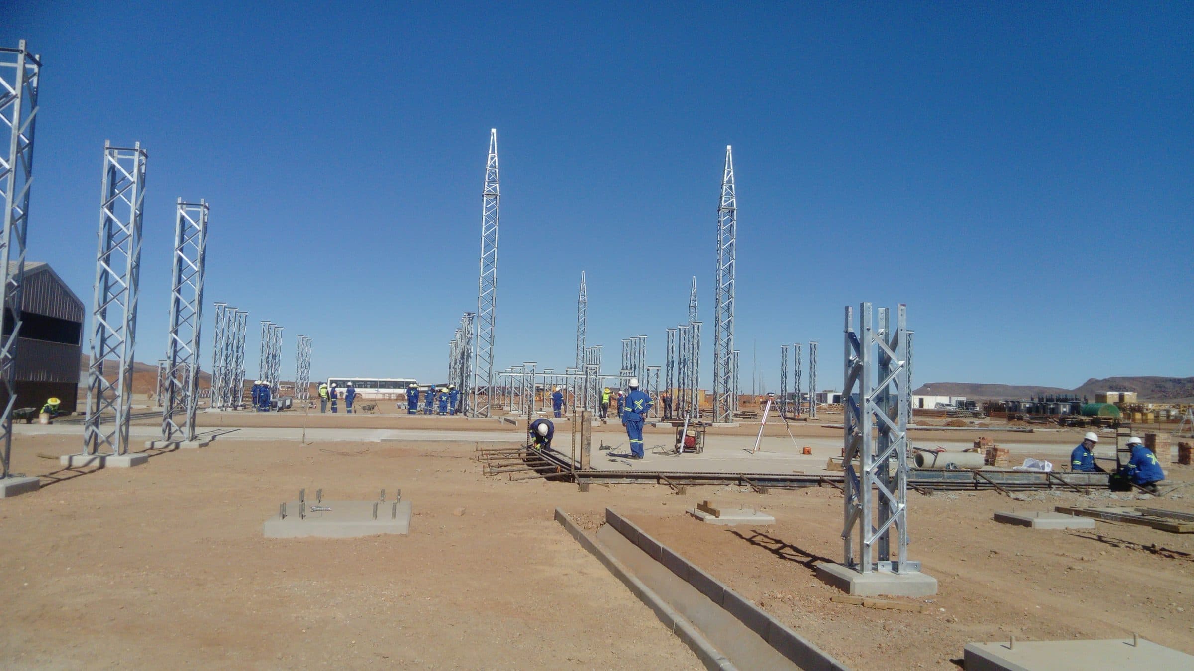 Galvanised steel lattice structures being erected across the Groeipunt substation platform