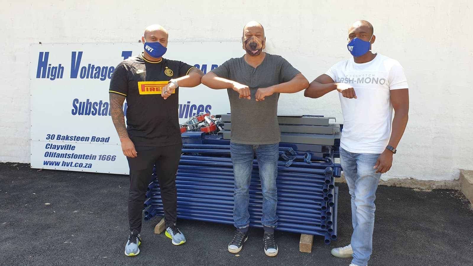 HVT representatives with John Mphatsoe of MIG Construction beside sponsored scaffolding equipment