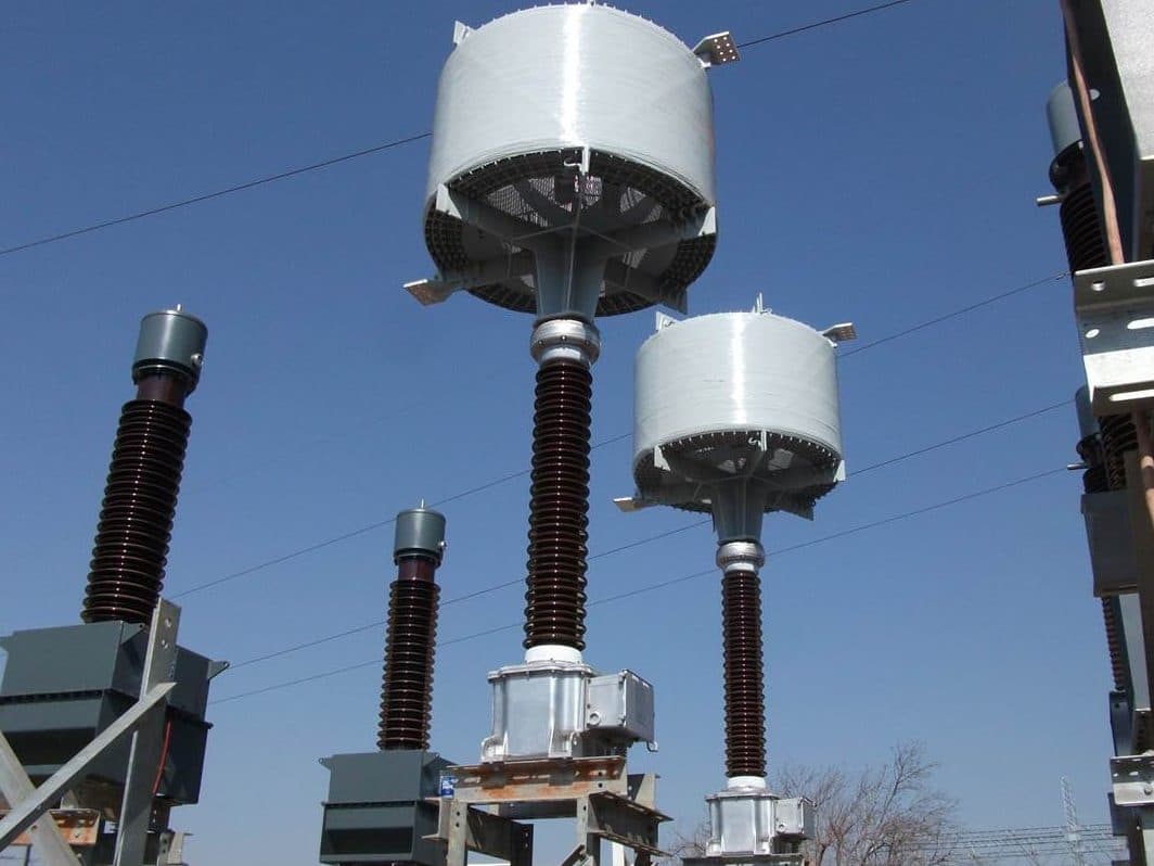 High-voltage substation equipment with line traps mounted on top of capacitor voltage transformers